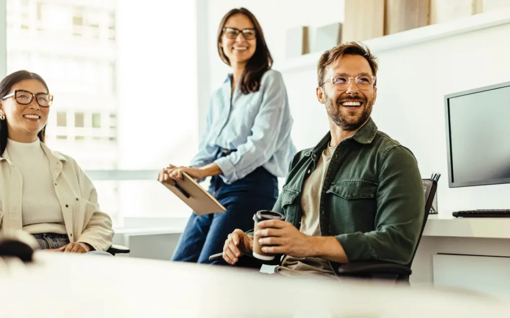 Three people working together at a table.